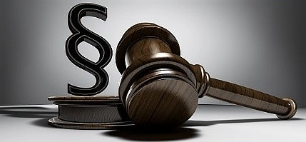 Männchen zeigt auf Paragraph